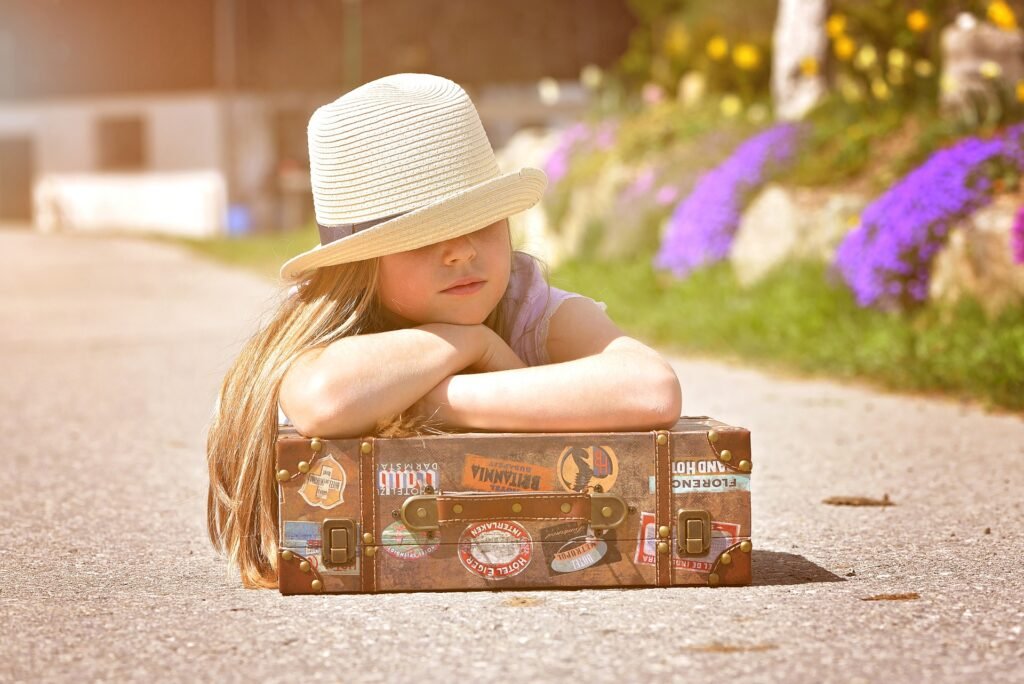 A Beginner’s Travel Guide - Child with suitcase